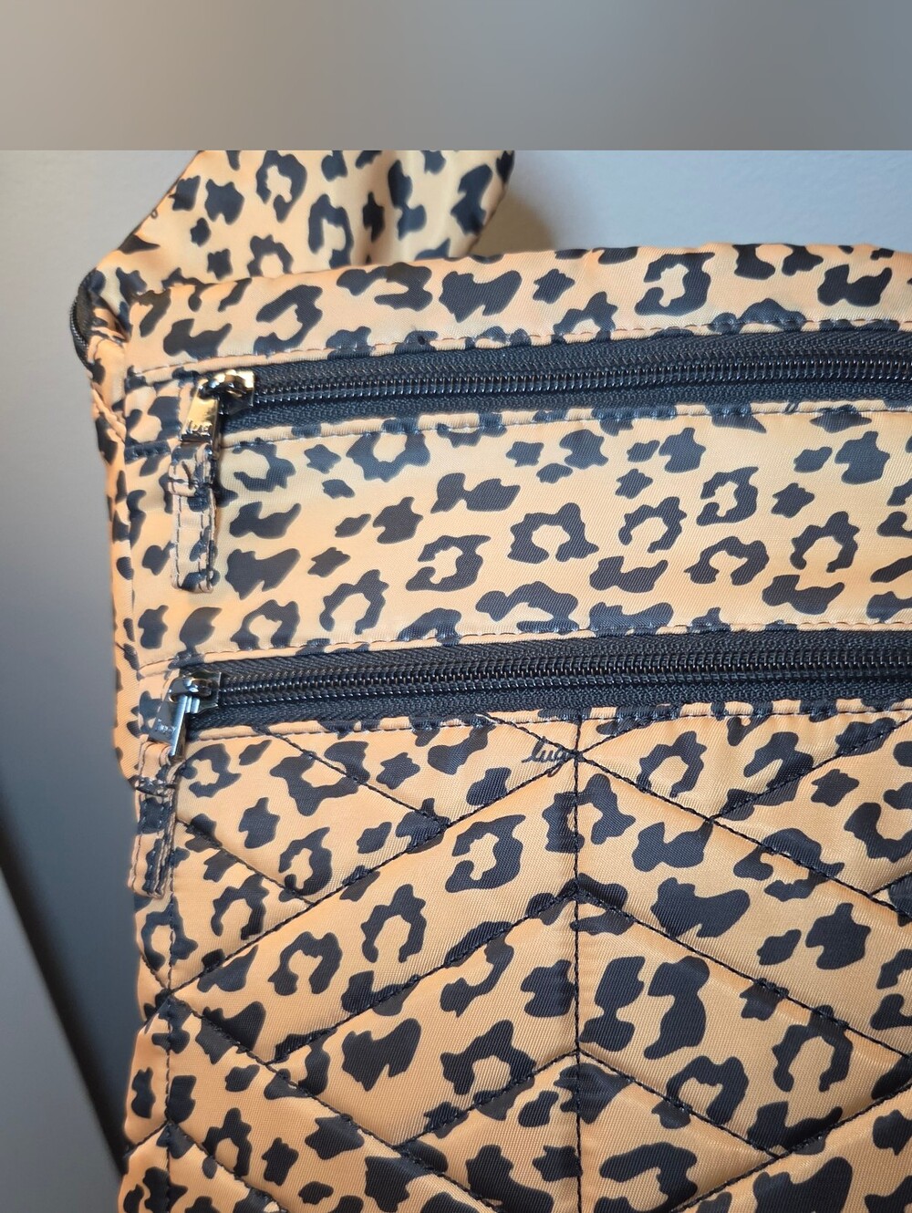 Lug Skipper Crossbody Bag in the Spotted Leopard RFID